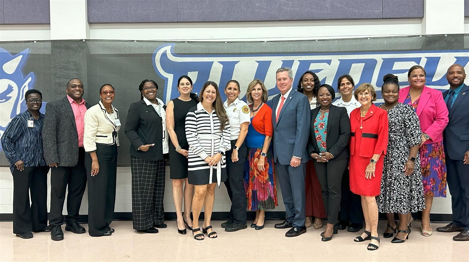  Lawyers, community members, and district employees of the Belle Glade area celebrate governance day